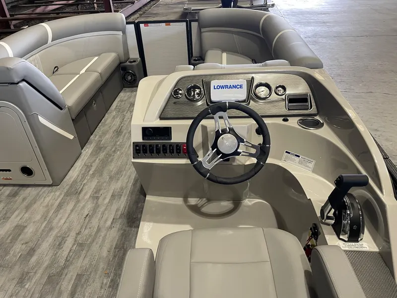 Slide: The Image of 2024 Crest 220 SLSC Classic DLX boat interior with steering console and seating. - 8