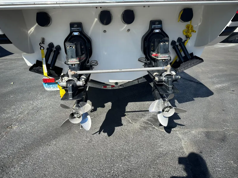 Slide: The Image of 2004 Formula 292 FASTech boat with dual propellers on a concrete surface. - 5