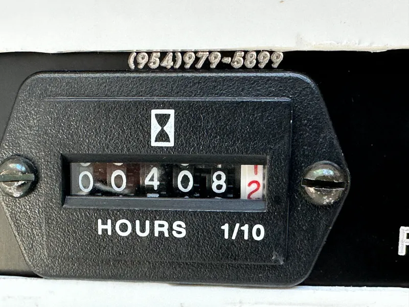 Slide: The Image of Hour meter showing 408.2 hours on a 2005 Intrepid 348 WA boat. - 12