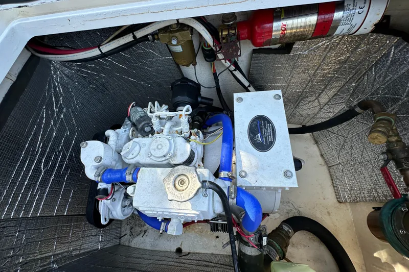 Slide: The Image of Engine compartment of a 2005 Intrepid 348 WA boat with fire extinguisher. - 22