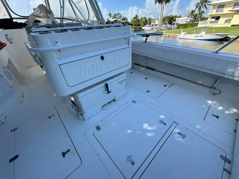 Slide: The Image of 2005 Intrepid 348 WA boat interior with seating and storage compartments. - 9