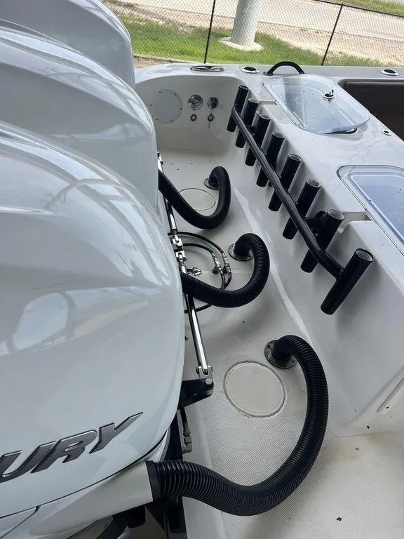 Slide: The Image of 2018 Fountain 38CC LS boat with Mercury engines and rod holders. - 10