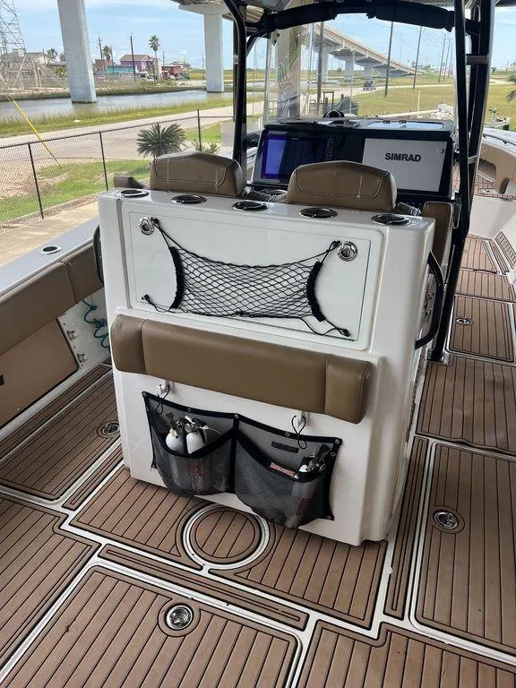 Slide: The Image of 2018 Fountain 38CC LS boat interior with seating and storage compartments. - 13