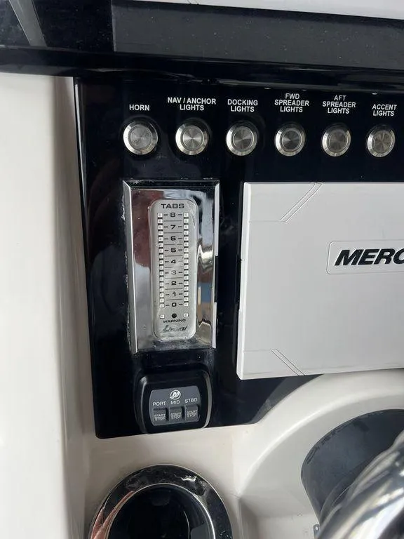 Slide: The Image of Control panel of 2018 Fountain 38CC LS boat with various switches and Mercury branding. - 18
