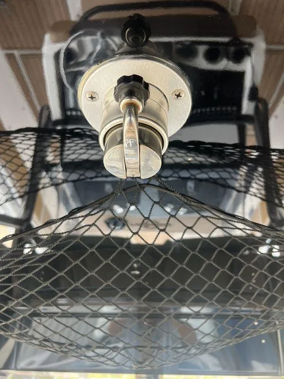 Slide: The Image of Close-up of a 2018 Fountain 38CC LS boat's steering wheel and dashboard. - 22