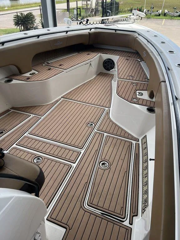 Slide: The Image of 2018 Fountain 38CC LS boat deck with teak flooring and spacious layout. - 24