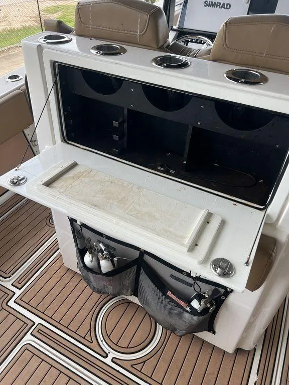 Slide: The Image of 2018 Fountain 38CC LS boat interior with storage and seating. - 25