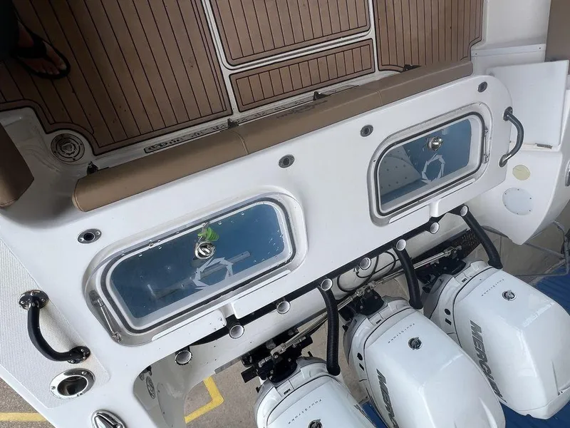 Slide: The Image of 2018 Fountain 38CC LS boat with twin livewells and triple Mercury outboard engines. - 36