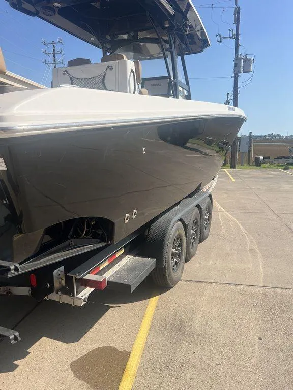Slide: The Image of 2018 Fountain 38CC LS boat on trailer in parking lot. - 4