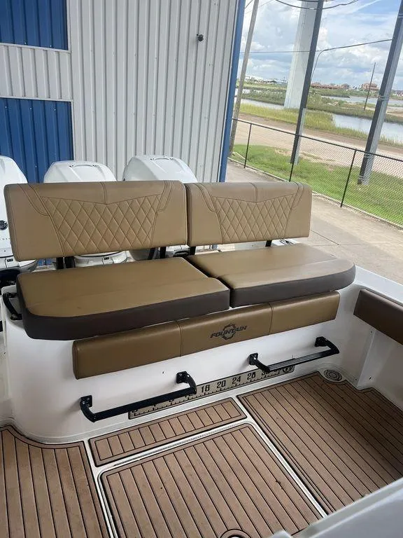 Slide: The Image of 2018 Fountain 38CC LS boat with tan leather seating and teak flooring. - 42