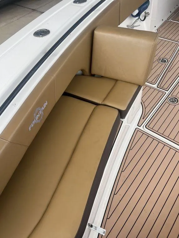 Slide: The Image of 2018 Fountain 38CC LS boat with tan leather seating and teak-style flooring. - 45