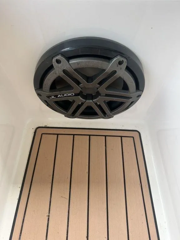 Slide: The Image of JL Audio speaker on 2018 Fountain 38CC LS boat with teak flooring. - 47
