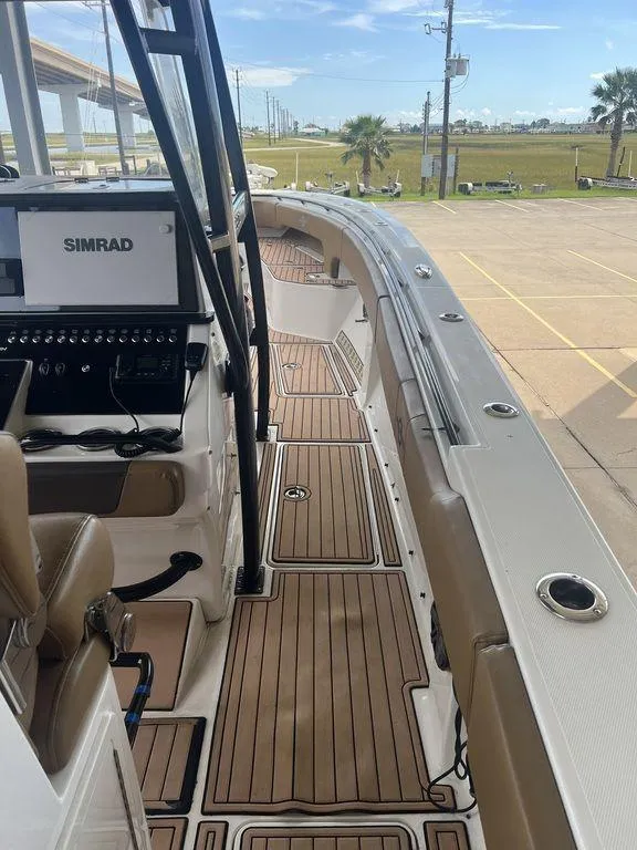 Slide: The Image of 2018 Fountain 38CC LS boat with teak deck and Simrad navigation system. - 48