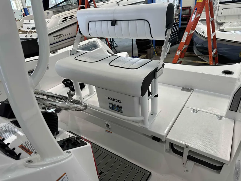 Slide: The Image of 2025 Yamaha Boats 222 FSH Sport interior with seating and steering wheel. - 13