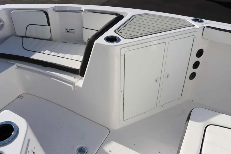 Slide: The Image of 2025 Yamaha Boats 222 FSH Sport interior seating and storage area. - 16