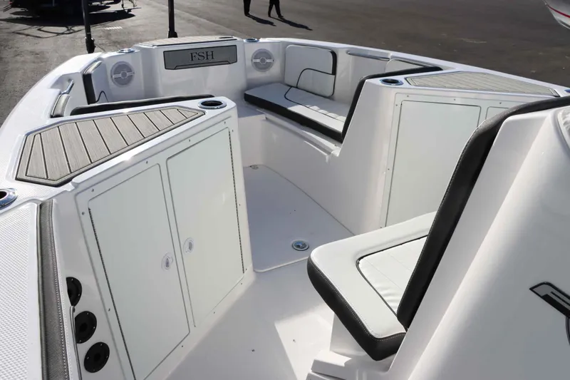 Slide: The Image of 2025 Yamaha Boats 222 FSH Sport interior with seating and storage compartments. - 17