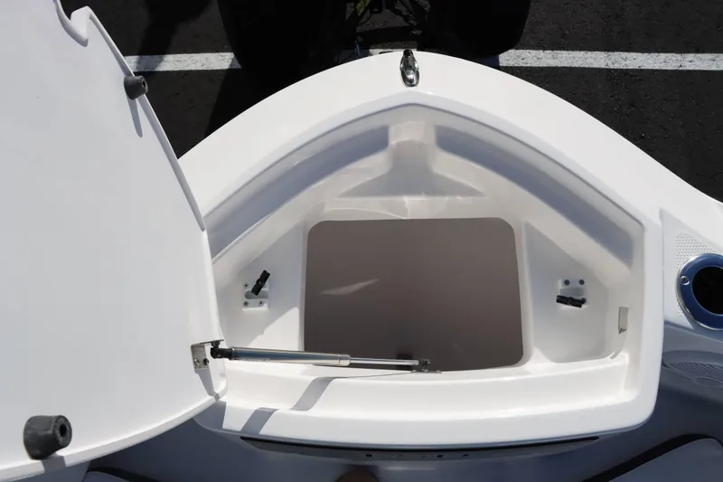 Slide: The Image of Open storage compartment on 2025 Yamaha Boats 222 FSH Sport. - 23