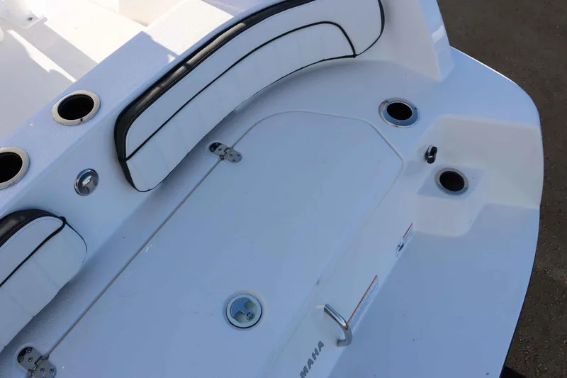 Slide: The Image of 2025 Yamaha Boats 222 FSH Sport deck with seating and cup holders. - 6