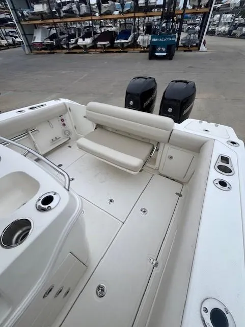Slide: The Image of 2020 Boston Whaler 280 Outrage boat interior with seating and dual engines. - 11