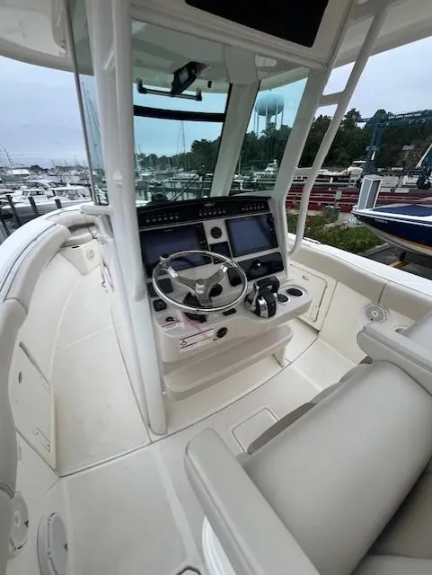 Slide: The Image of 2020 Boston Whaler 280 Outrage helm with advanced navigation systems and comfortable seating. - 19