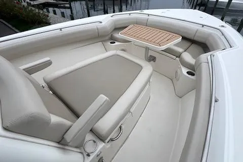 Slide: The Image of 2020 Boston Whaler 280 Outrage boat interior with seating and table. - 27