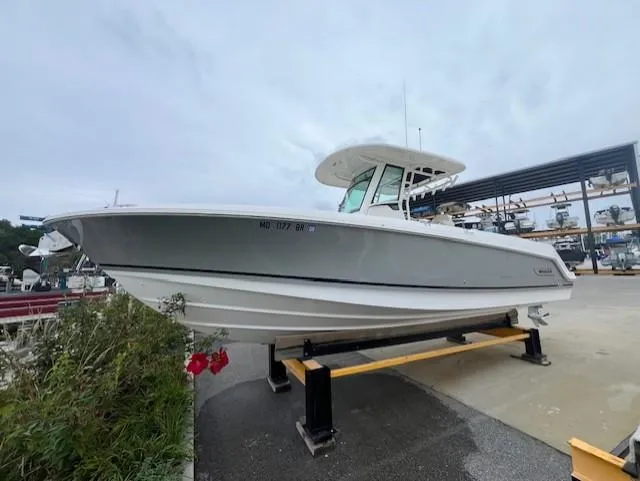 Slide: The Image of 2020 Boston Whaler 280 Outrage boat on display at a marina. - 3