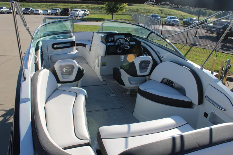 Slide: The Image of 2024 Crownline Eclipse E255 boat seating area with sleek, modern design and comfortable upholstery. - 10