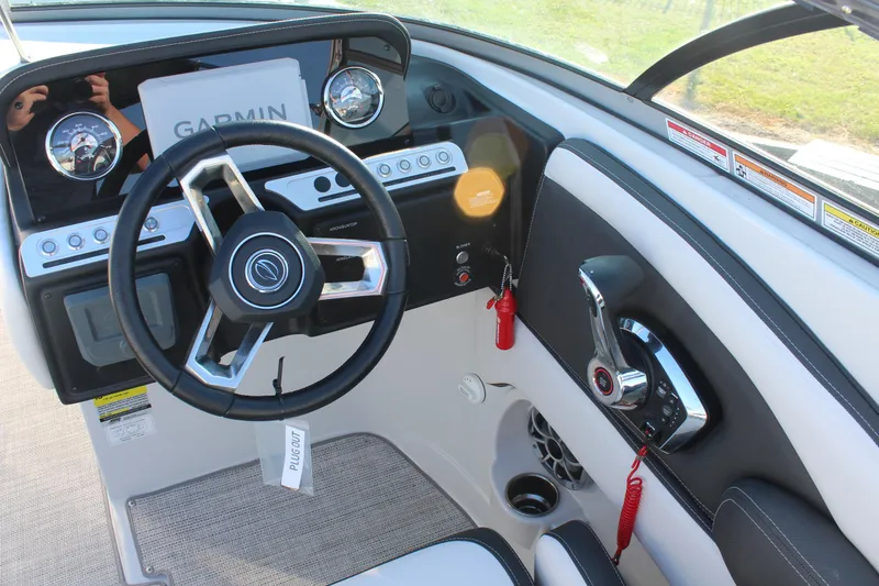 Slide: The Image of Storage compartment on 2024 Crownline Eclipse E255 boat, open lid view. - 12