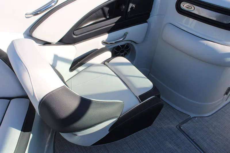 Slide: The Image of 2024 Crownline Eclipse E255 boat interior with sleek seating and modern controls. - 15
