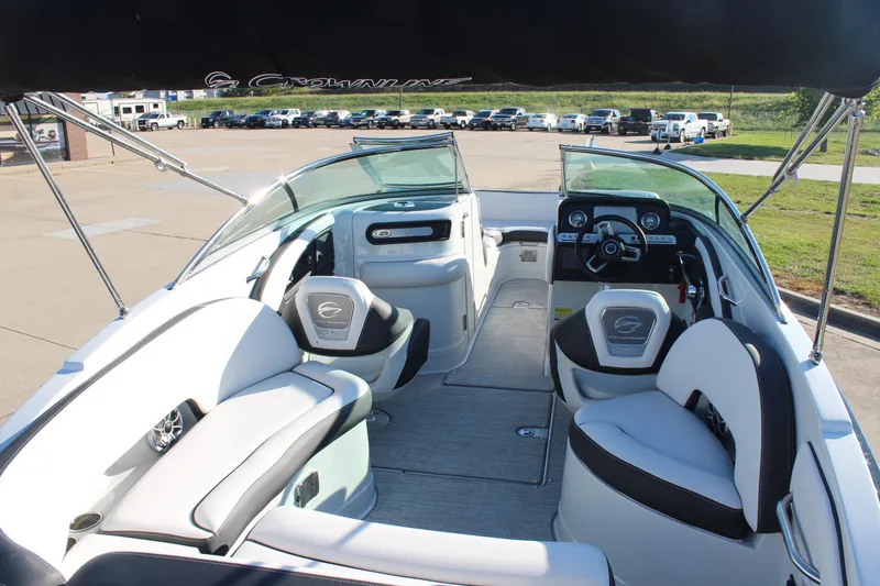 Slide: The Image of 2024 Crownline Eclipse E255 boat on trailer at dealership. - 2