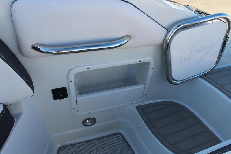 Slide: The Image of 2024 Crownline Eclipse E255 dashboard with steering wheel and Garmin display. - 22