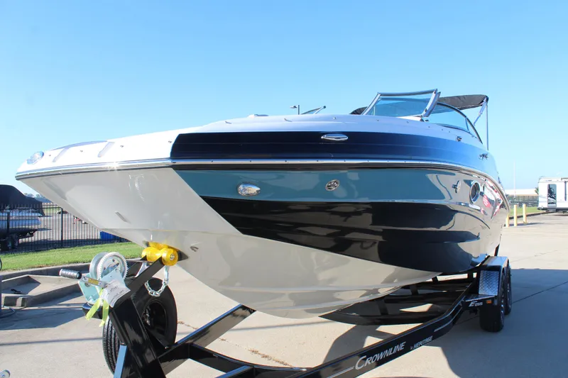 Slide: The Image of 2024 Crownline Eclipse E255 boat interior with sink and portable toilet. - 24