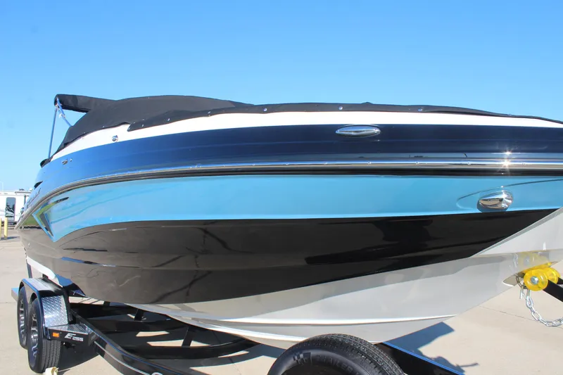 Slide: The Image of 2024 Crownline Eclipse E255 boat interior with sink, mirror, and granite countertop. - 26