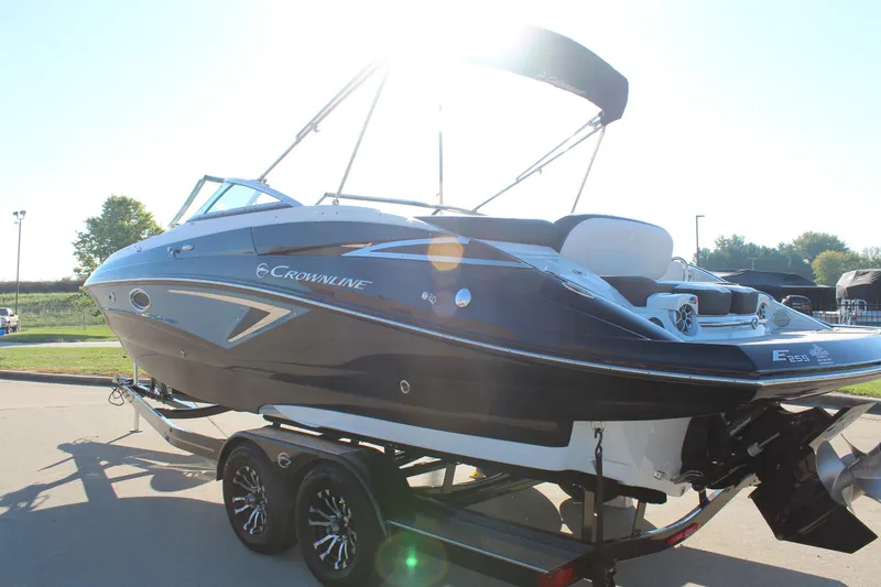 Slide: The Image of 2024 Crownline Eclipse E255 boat interior with plush seating and modern design. - 29