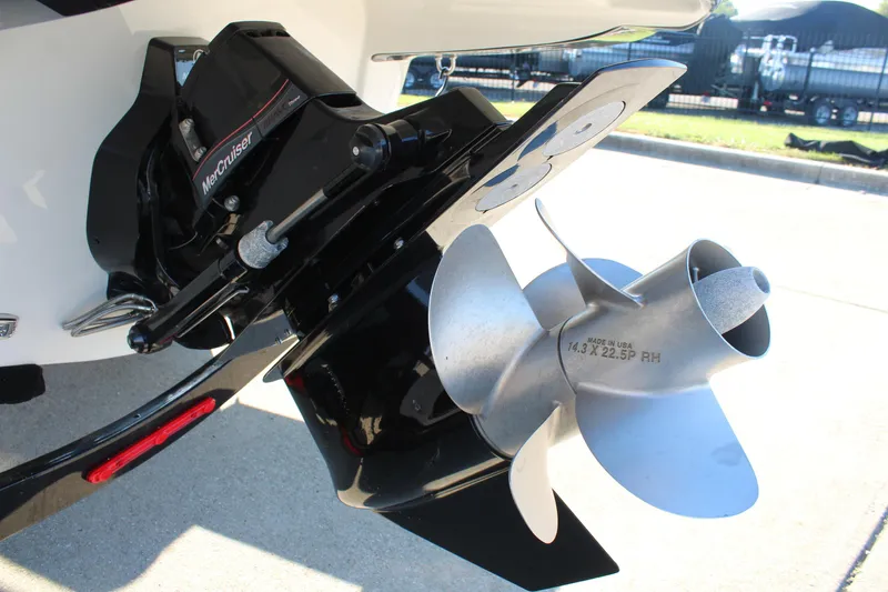 Slide: The Image of 2024 Crownline Eclipse E255 boat storage compartment with cup holders and seating area. - 31