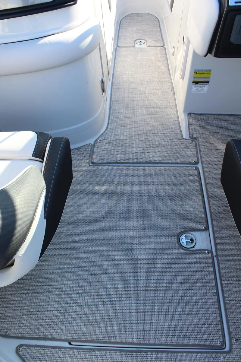 Slide: The Image of 2024 Crownline Eclipse E255 boat storage compartment with cooler. - 33