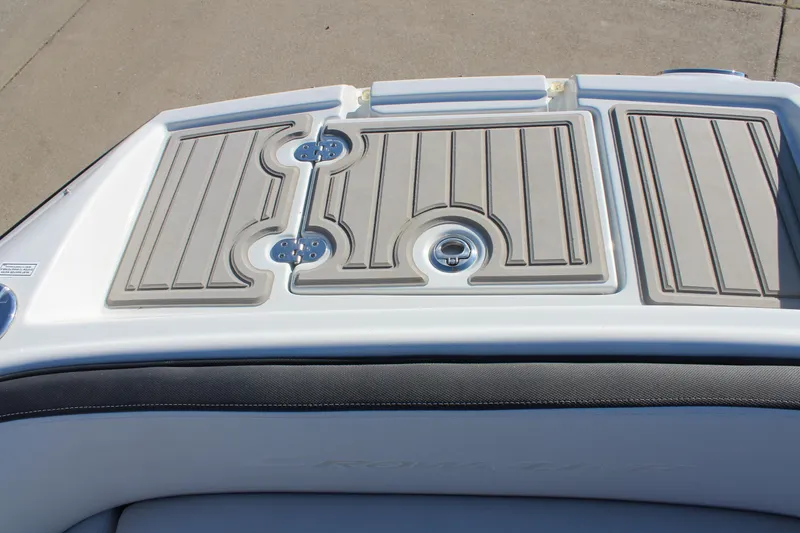 Slide: The Image of 2024 Crownline Eclipse E255 boat on trailer, sleek design, blue and black color scheme. - 4