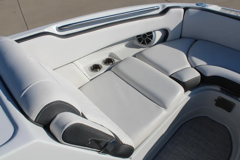 Slide: The Image of 2024 Crownline Eclipse E255 boat on trailer, outdoor dealership display. - 8