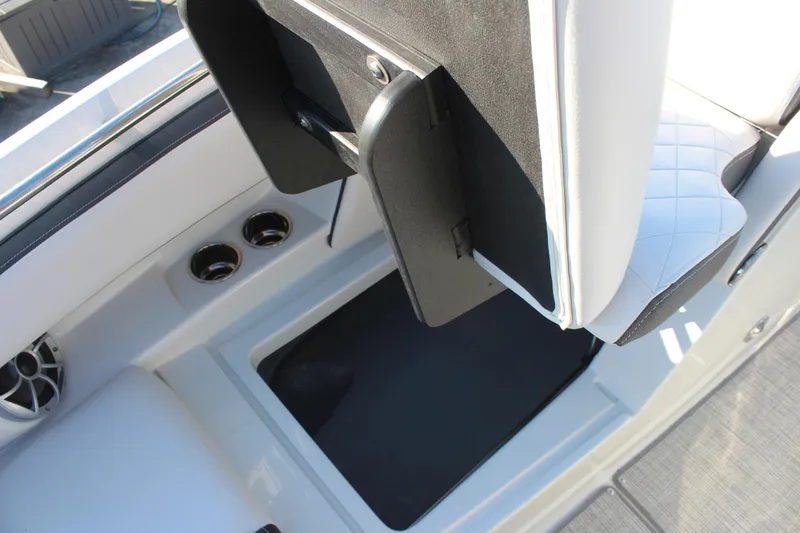Slide: The Image of 2024 Crownline Eclipse E255 boat interior with sleek seating and modern dashboard design. - 9