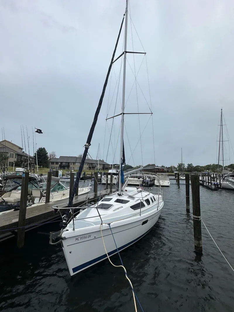 The Image of Sailboat docked in marina, 2001 Hunter 320 model, overcast sky. - 0