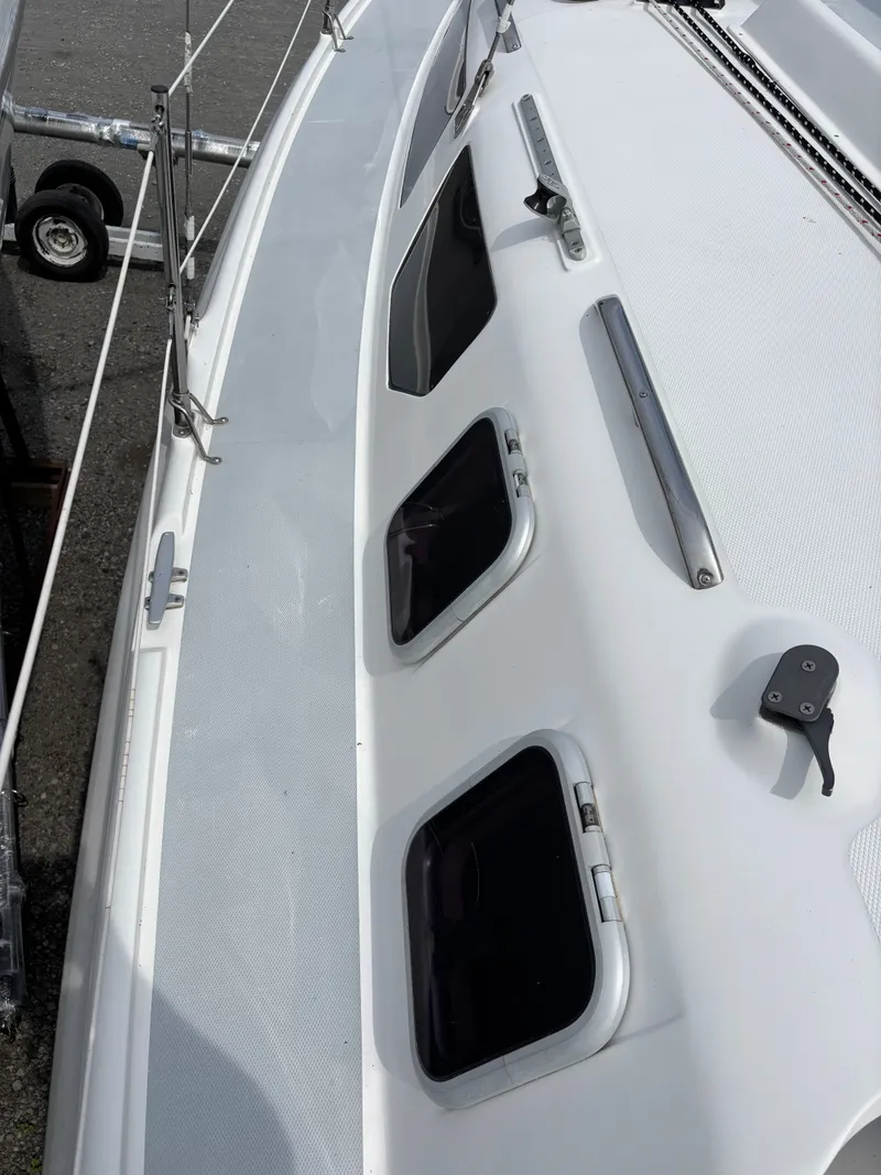 Slide: The Image of 2001 Hunter 320 sailboat deck with windows and railing. - 12