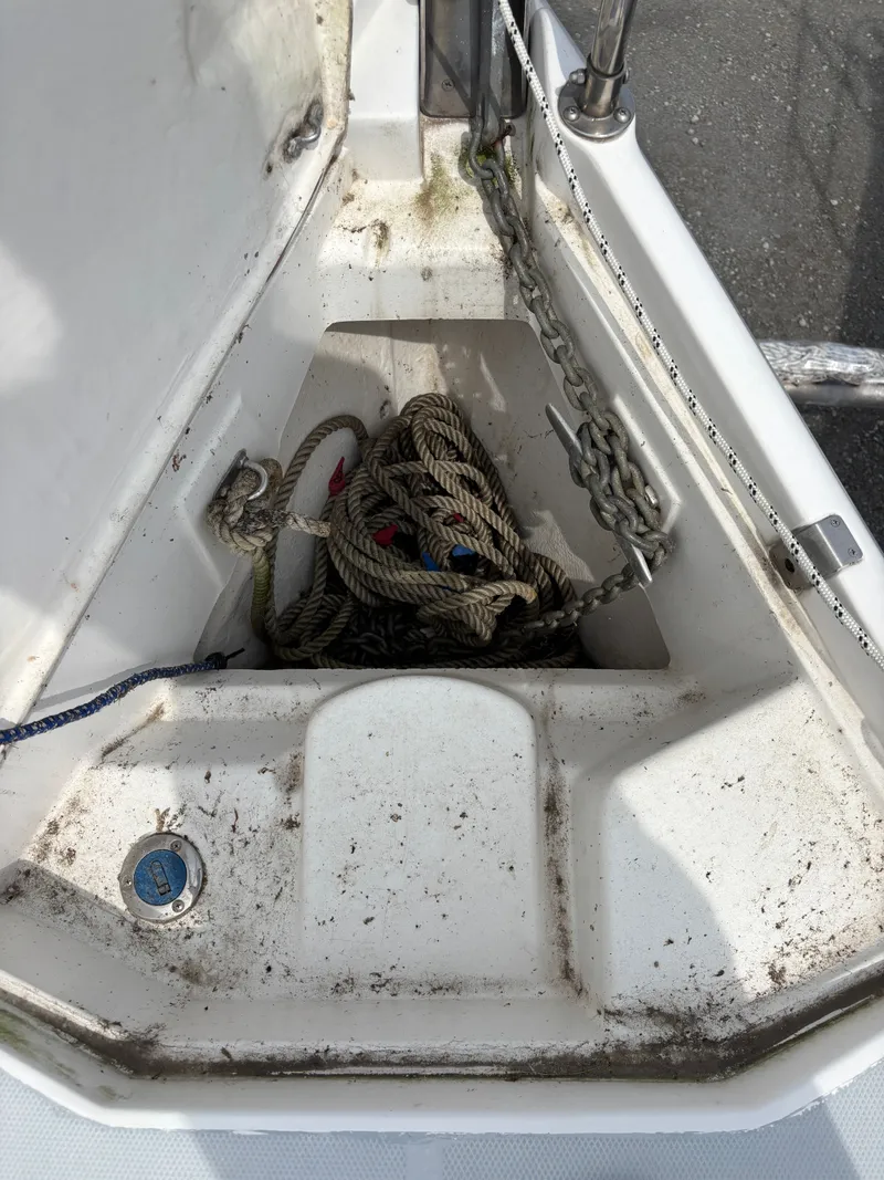 Slide: The Image of Anchor locker of a 2001 Hunter 320 sailboat with ropes and chain. - 18