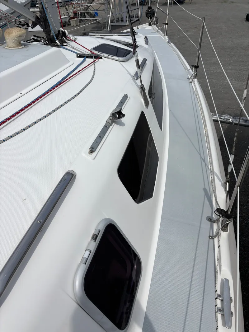 Slide: The Image of 2001 Hunter 320 sailboat deck with windows and rigging details. - 24