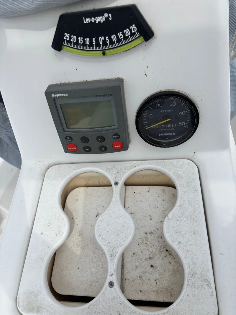 Slide: The Image of Control panel of 2001 Hunter 320 sailboat with gauges and autopilot. - 33