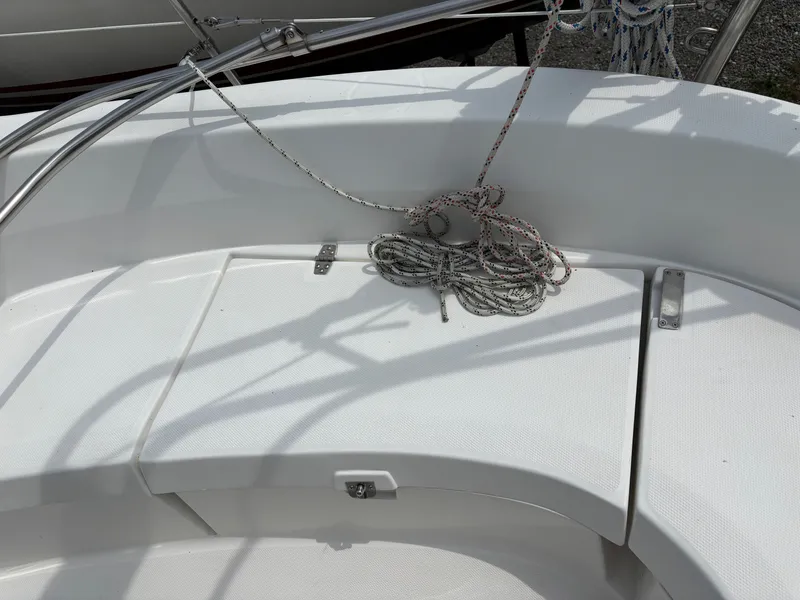 Slide: The Image of Cockpit of 2001 Hunter 320 sailboat with coiled ropes and stainless steel fittings. - 36