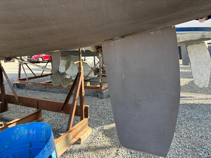 Slide: The Image of Underside of a 2001 Hunter 320 sailboat with visible propeller and rudder. - 6