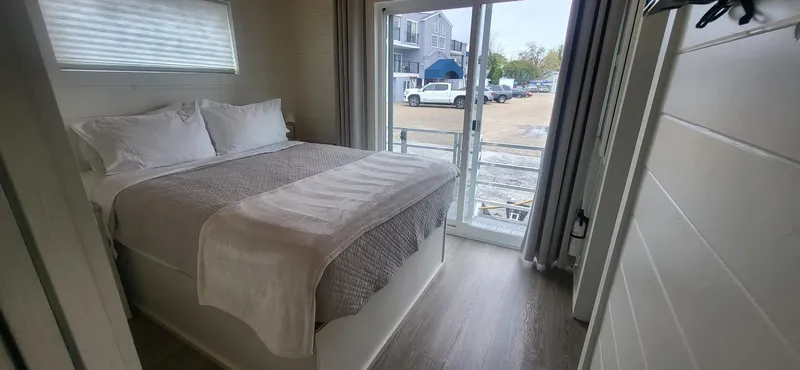 Slide: The Image of Cozy bedroom in 2020 Destination Yachts 16x45 Condo Series houseboat. - 13