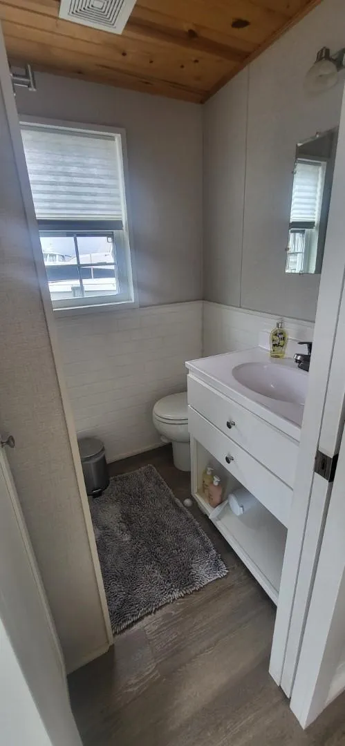 Slide: The Image of Bathroom in 2020 Destination Yachts 16x45 Condo Series, featuring modern fixtures and wood ceiling. - 14