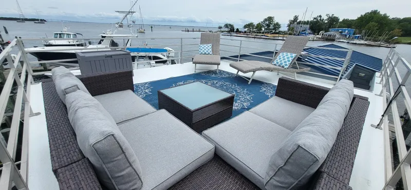 Slide: The Image of Luxury rooftop deck on 2020 Destination Yachts 16x45 Condo Series, featuring modern outdoor seating. - 26