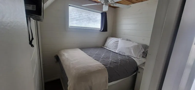 Slide: The Image of Cozy bedroom in 2020 Destination Yachts 16x45 Condo Series houseboat. - 12